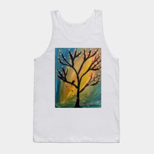 Black bird in the tree as the wind blows leaves off the tree Tank Top